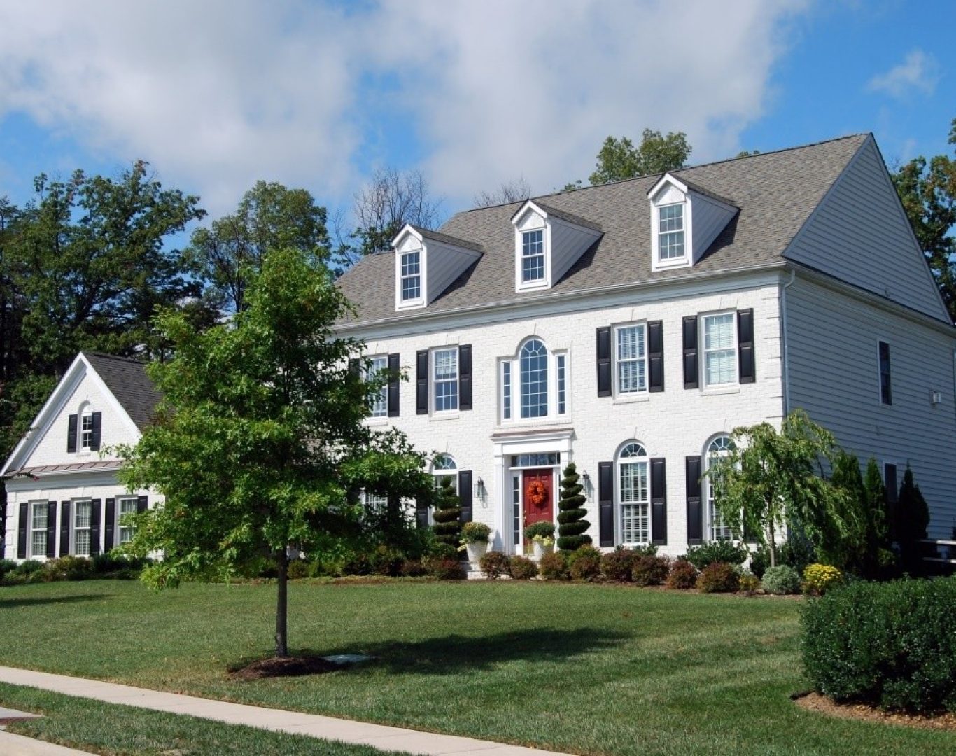 Happy home buyers working with a Randolph, MA real estate expert